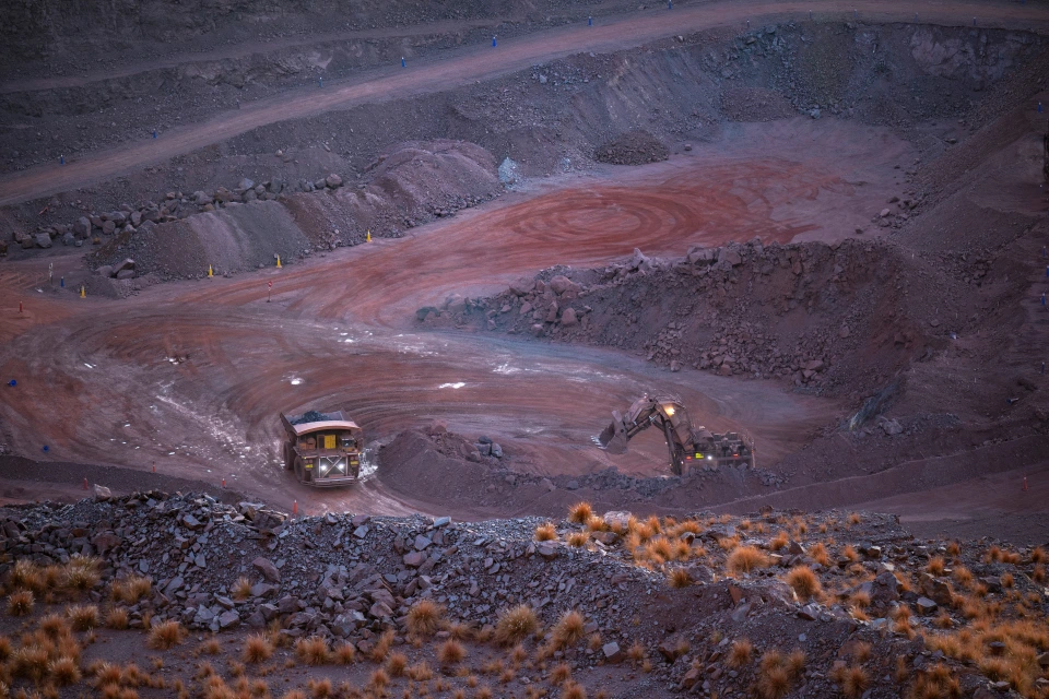 A haul truck and excavator in an Exxaro metals operation.